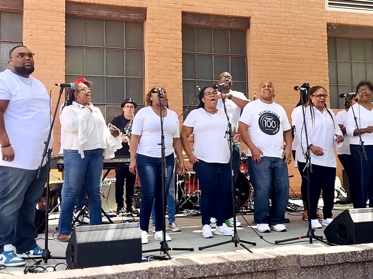 A choir performing outdoors