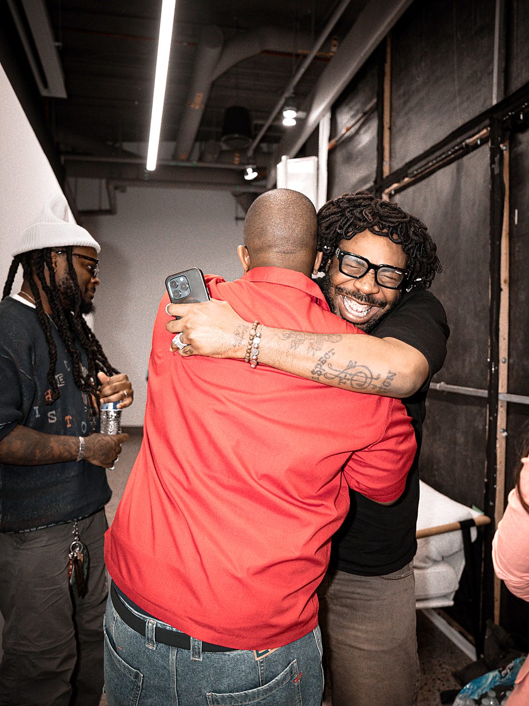 Two attendees embracing